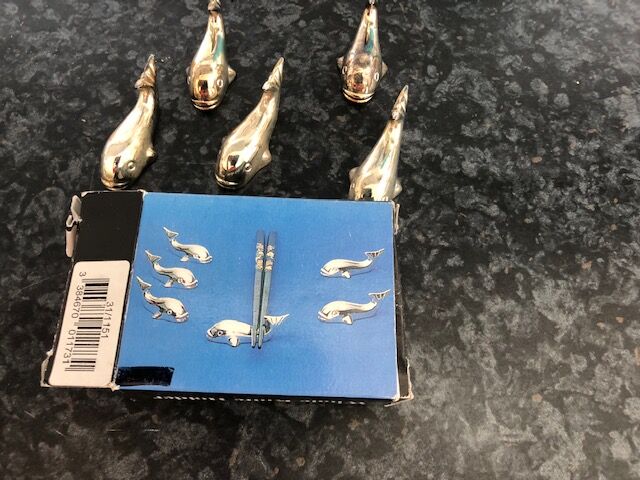 5 silver metal knife holders, whale