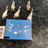 5 silver metal knife holders, whale