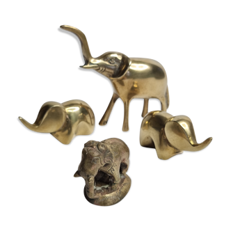 Set of four brass elephants