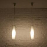 Doria pendant lights in lined frosted glass.