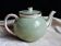 Antique Villeroy and Boch ceramic teapot in gold and celadon green.