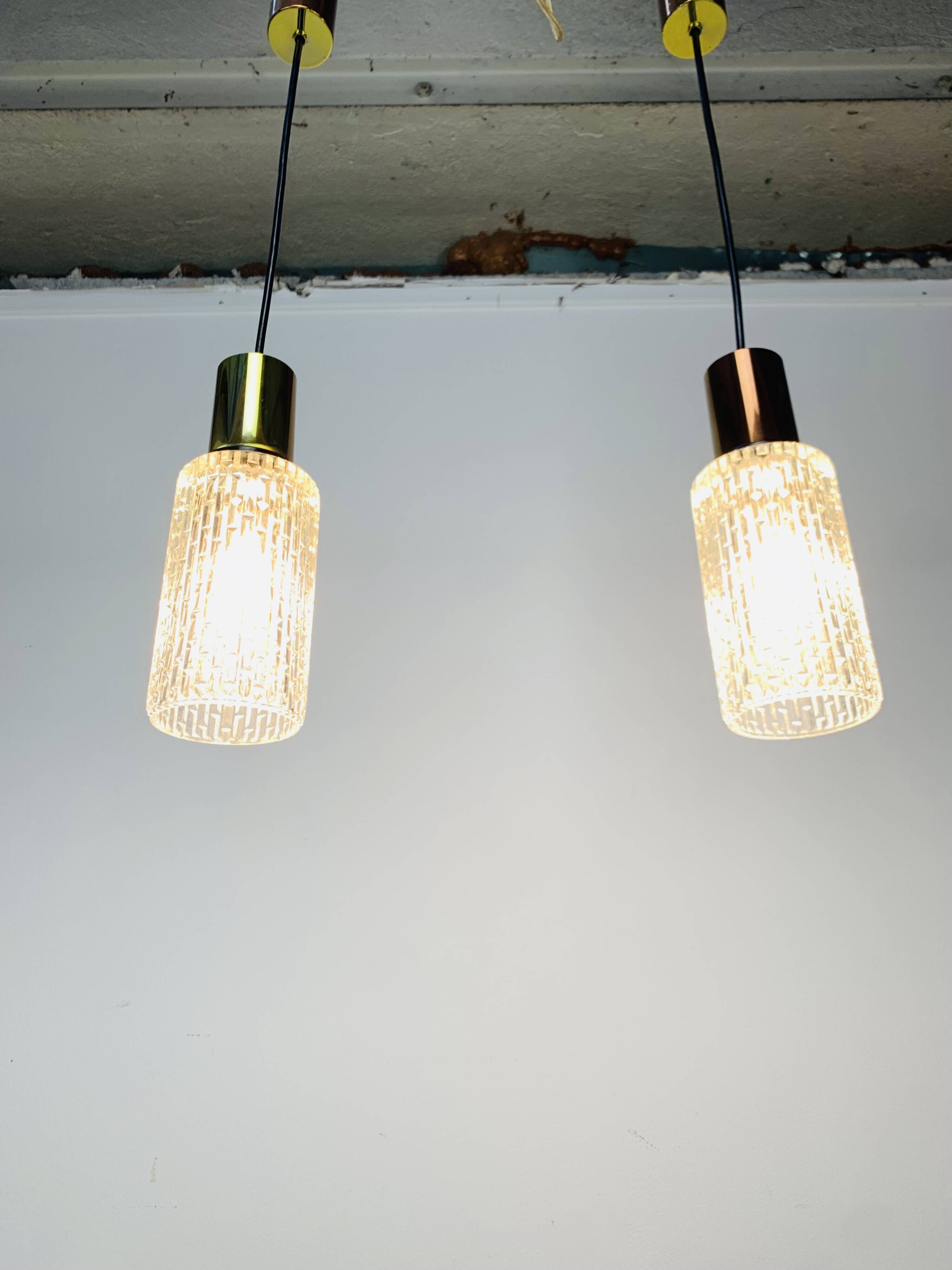 Pair of vintage cut glass pendant lights from the 1970s.