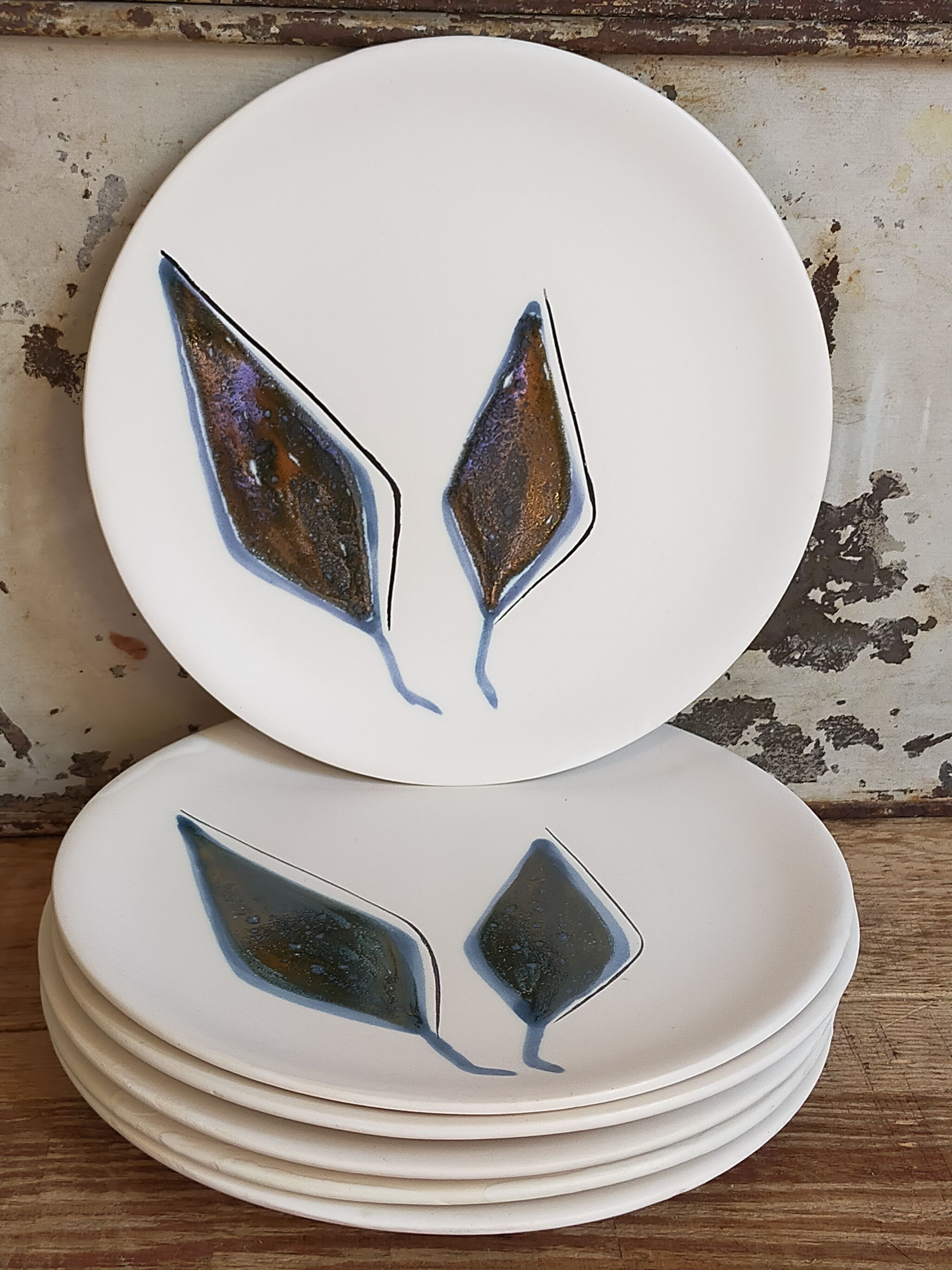 Six ceramic plates with matt enamel 50s