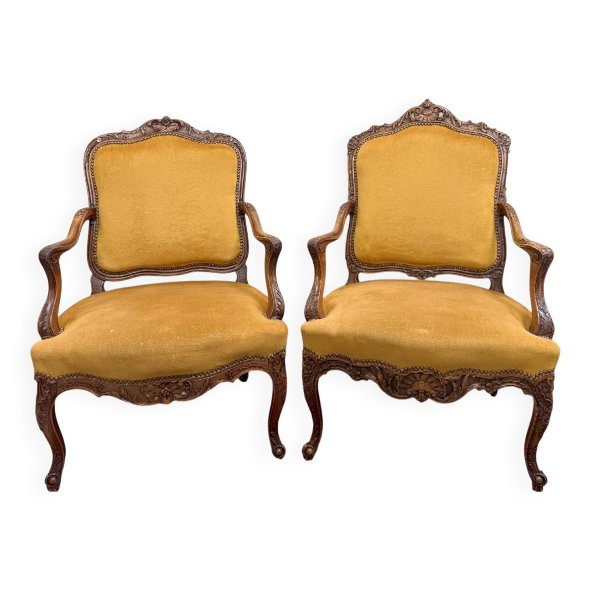 Pair of faux Louis XV armchairs in fully carved walnut