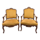 Pair of faux Louis XV armchairs in fully carved walnut