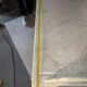 Antique wood and marble kitchen sideboard with carved backsplash