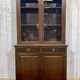 English walnut two-body library from the early 20th century.