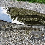 Oval coffee table of the 70s chromed metal base in s smoked glass top