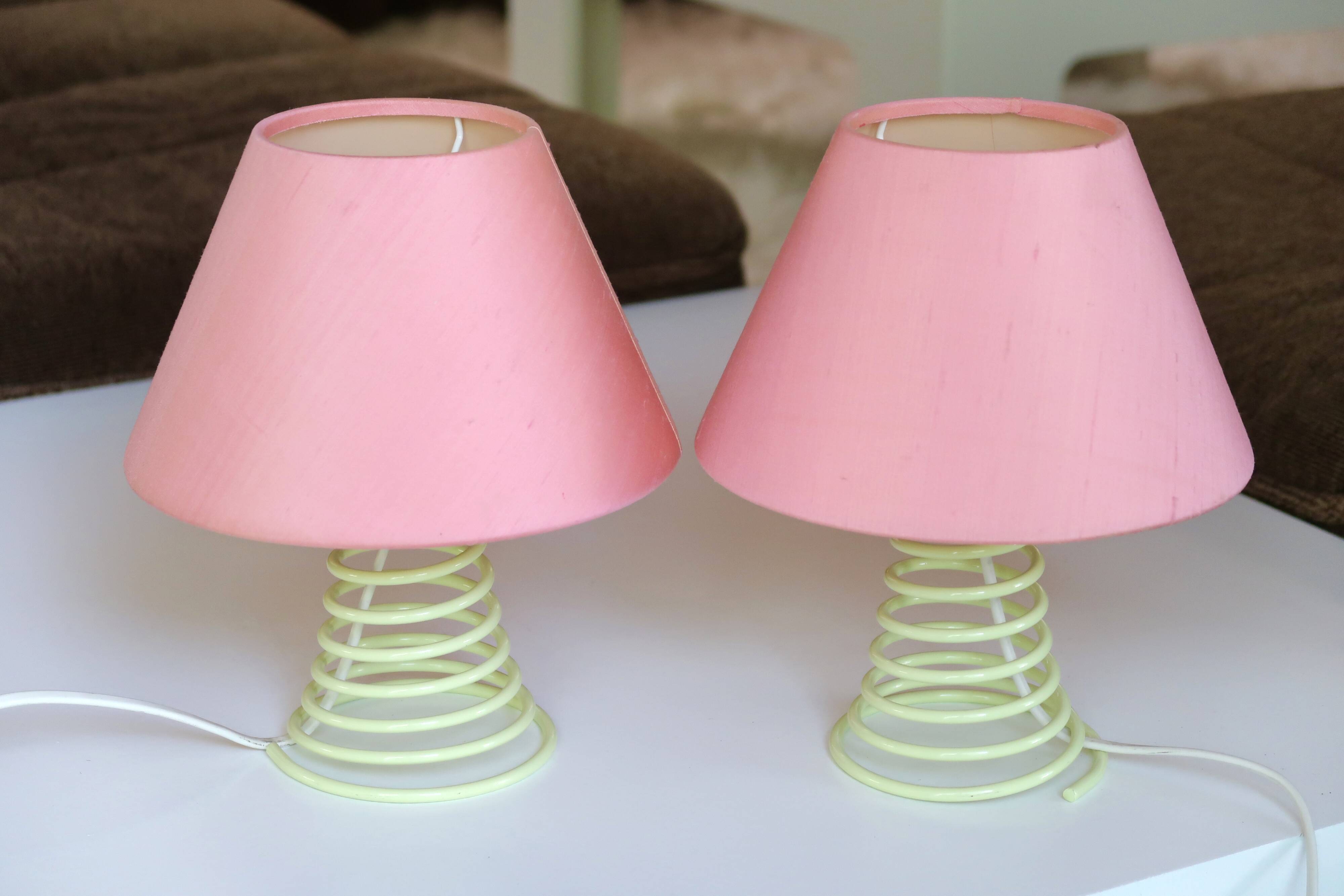 Pair of lamps, yellow spring foot, pink lampshade, 90s
