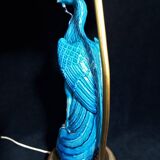 Large table lamp with earthenware peacock and beige silk lampshade
