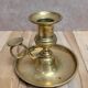 Antique brass candlestick with pusher