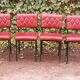 Série de 4 chaises rouges en skaï années 50