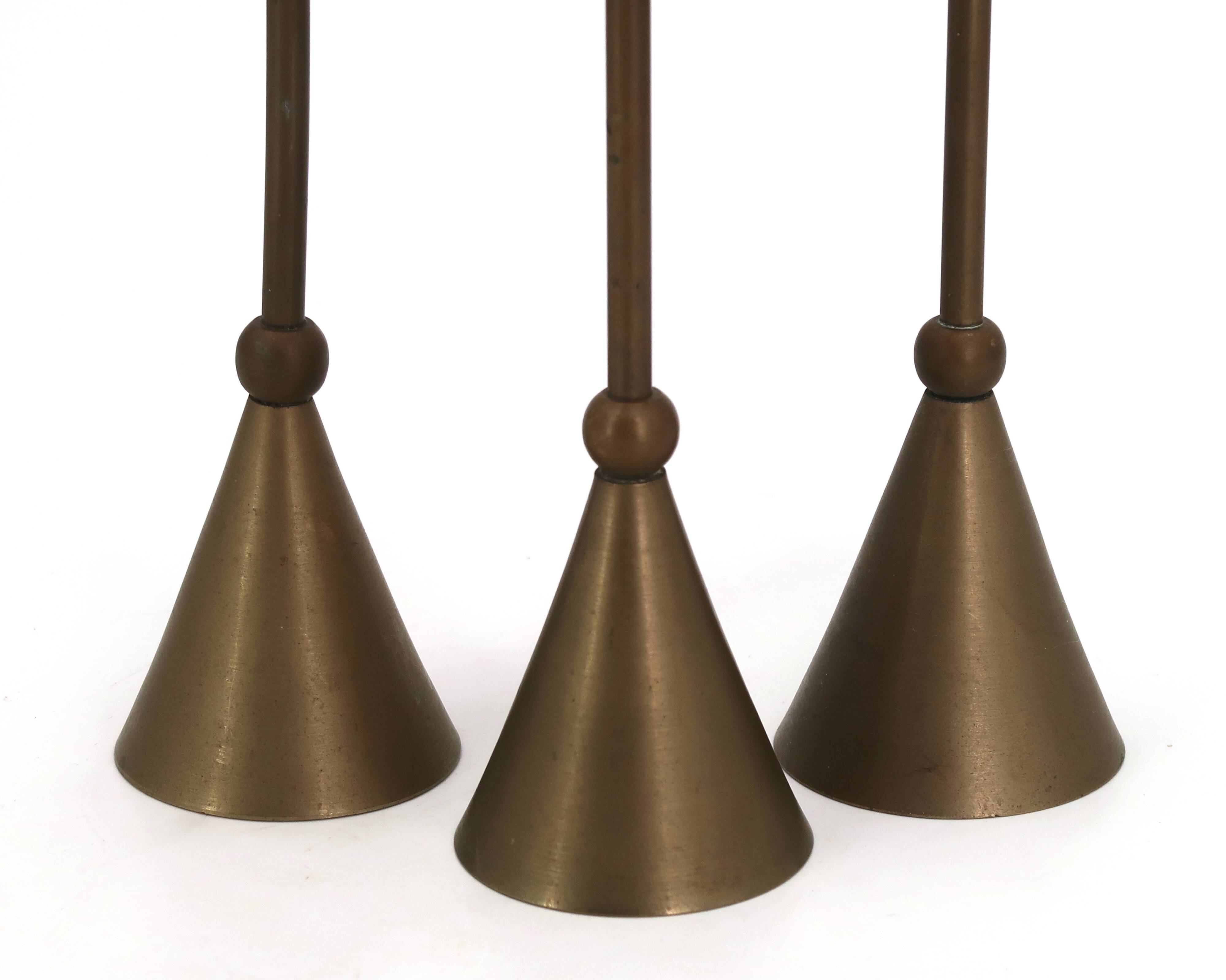 Brass candle holder trio by Christian de Beaumont, 1970s.