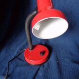 Articulated red desk lamp