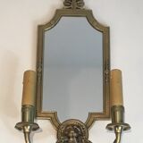 Pair of mirror and bronze wall lamps with lions' heads, french work. around 1940