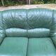 Vintage 2-seater sofa in green leather and solid wood