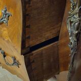 Curved Louis XV style commode with floral marquetry and marble top.