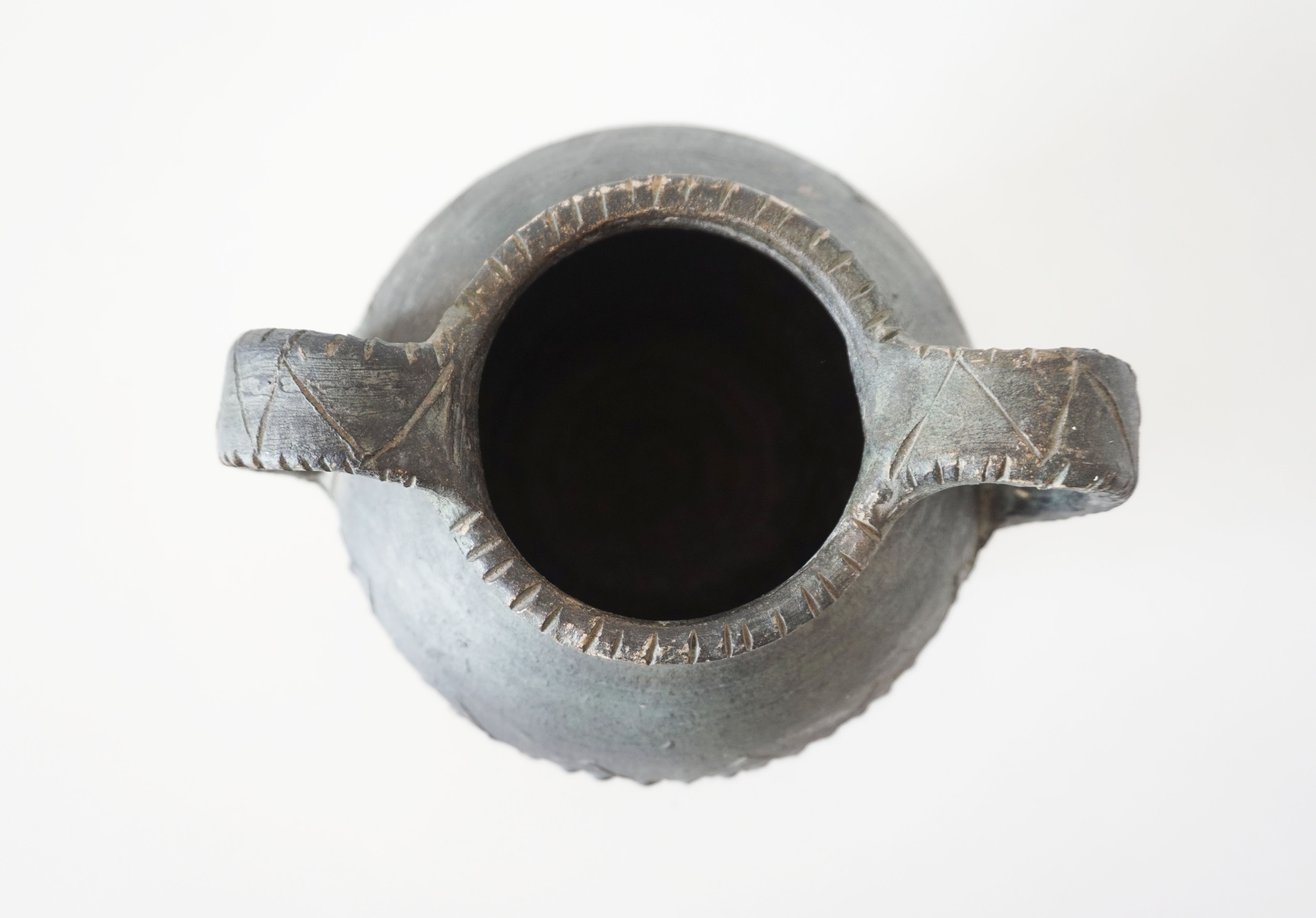 Vase with double handle in black sandstone