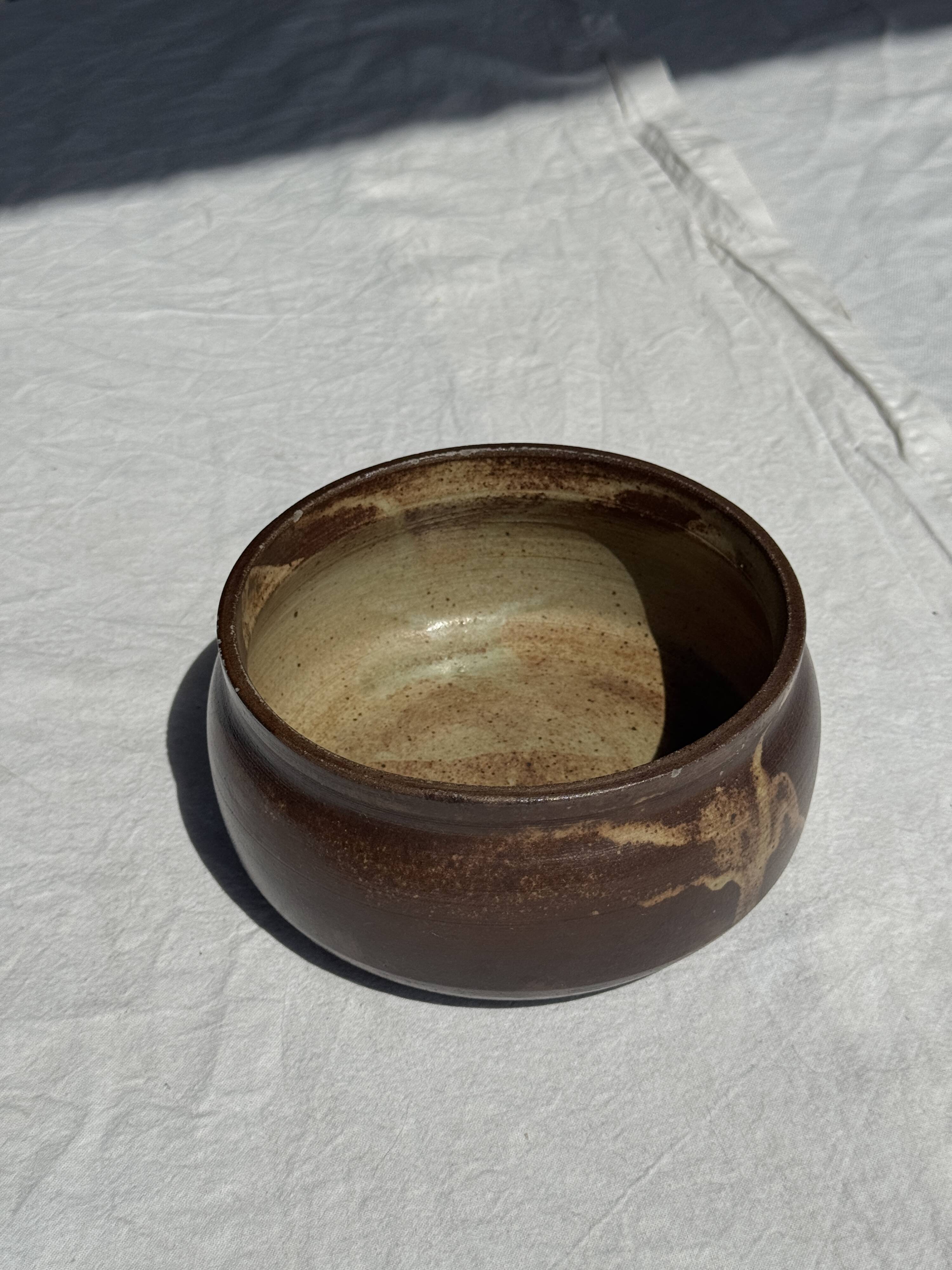 A small stoneware bowl, brown exterior, speckled grey interior D15