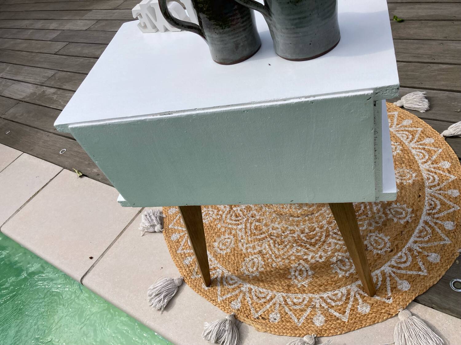 Beautiful vintage bedside table with tapered legs, Scandinavian/pop style in raw white.