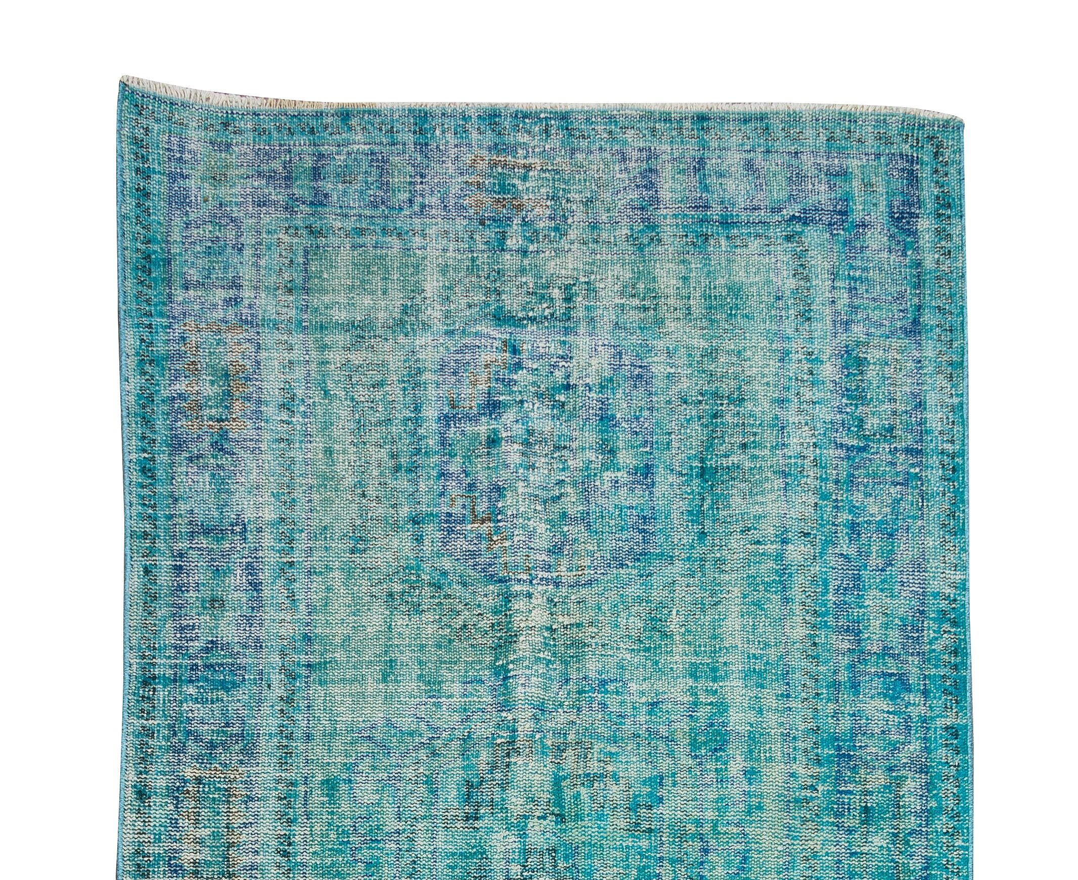 Vintage turkish rug over-dyed in teal blue color