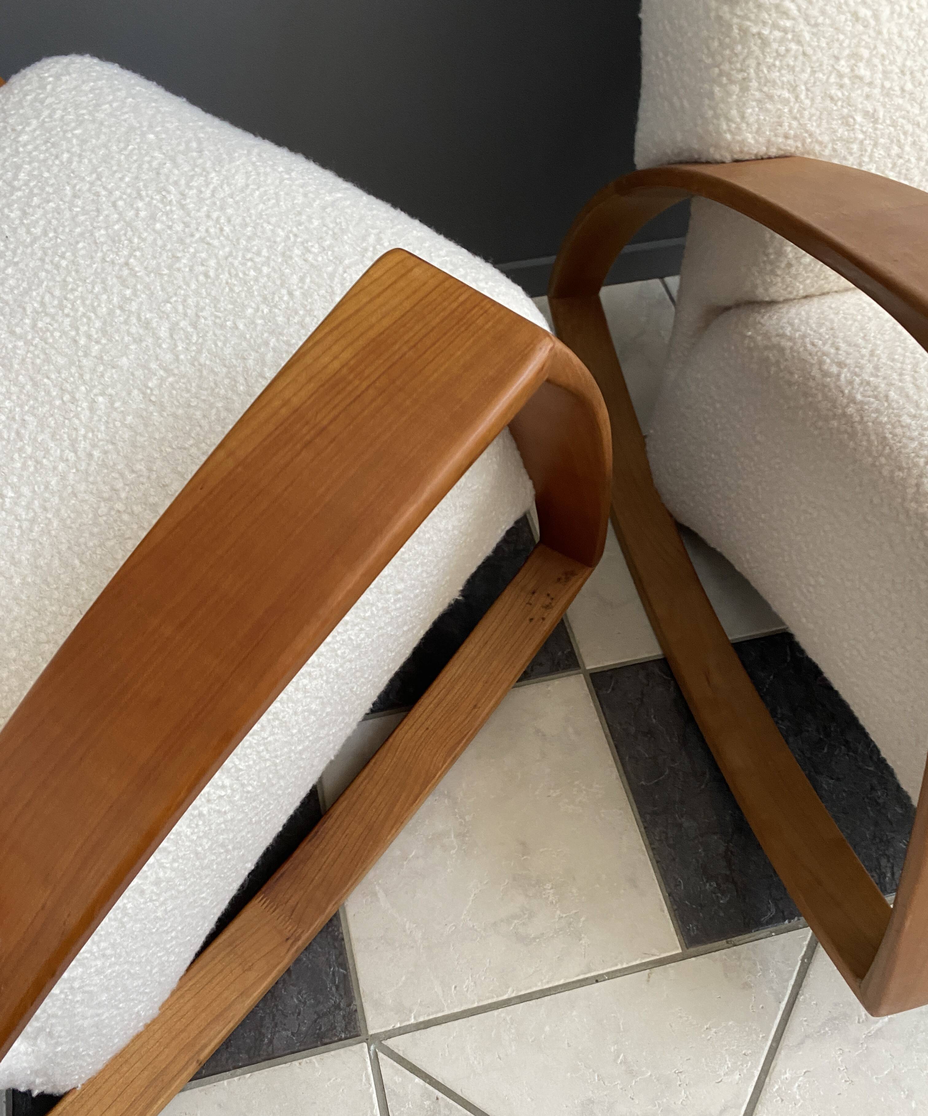 Pair of large rocking chairs reupholstered in White Boucle