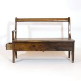 Handcrafted wooden bench with armrest and drawer on the right.