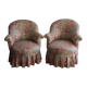 pair of toad armchairs in floral fabric.
