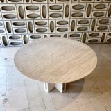 Round travertine dining table with double cross foot