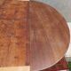 English oval table with 19th century mahogany extensions