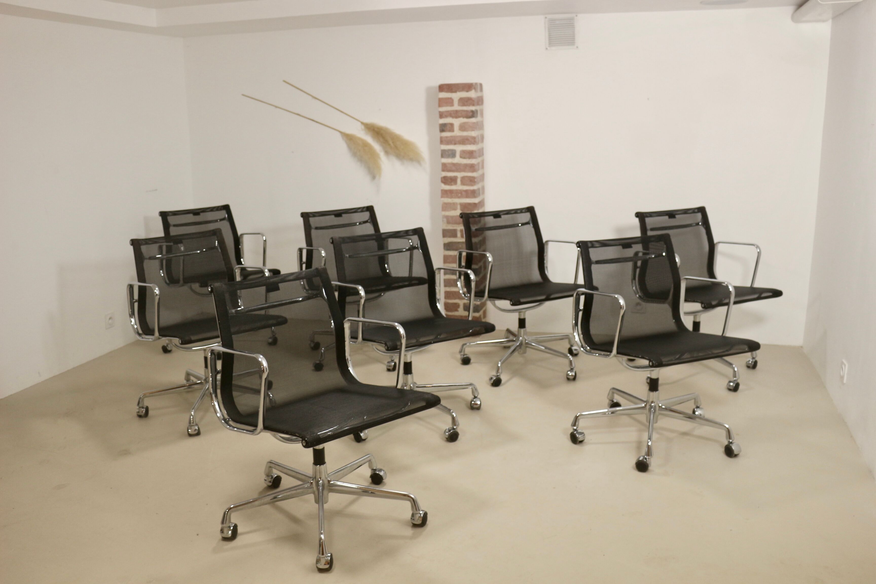 Set of 8 Charles and Ray Eames armchairs by Vitra model EA 117