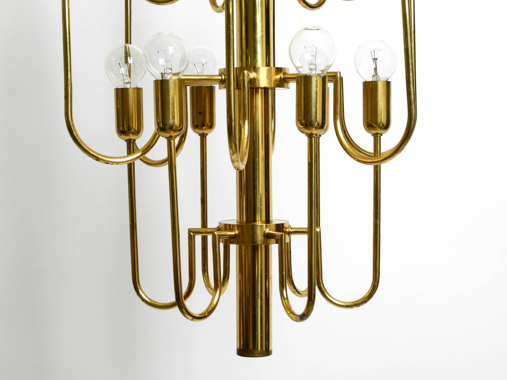 Three staged 18 arm Mid Century brass chandelier with a long brass rod