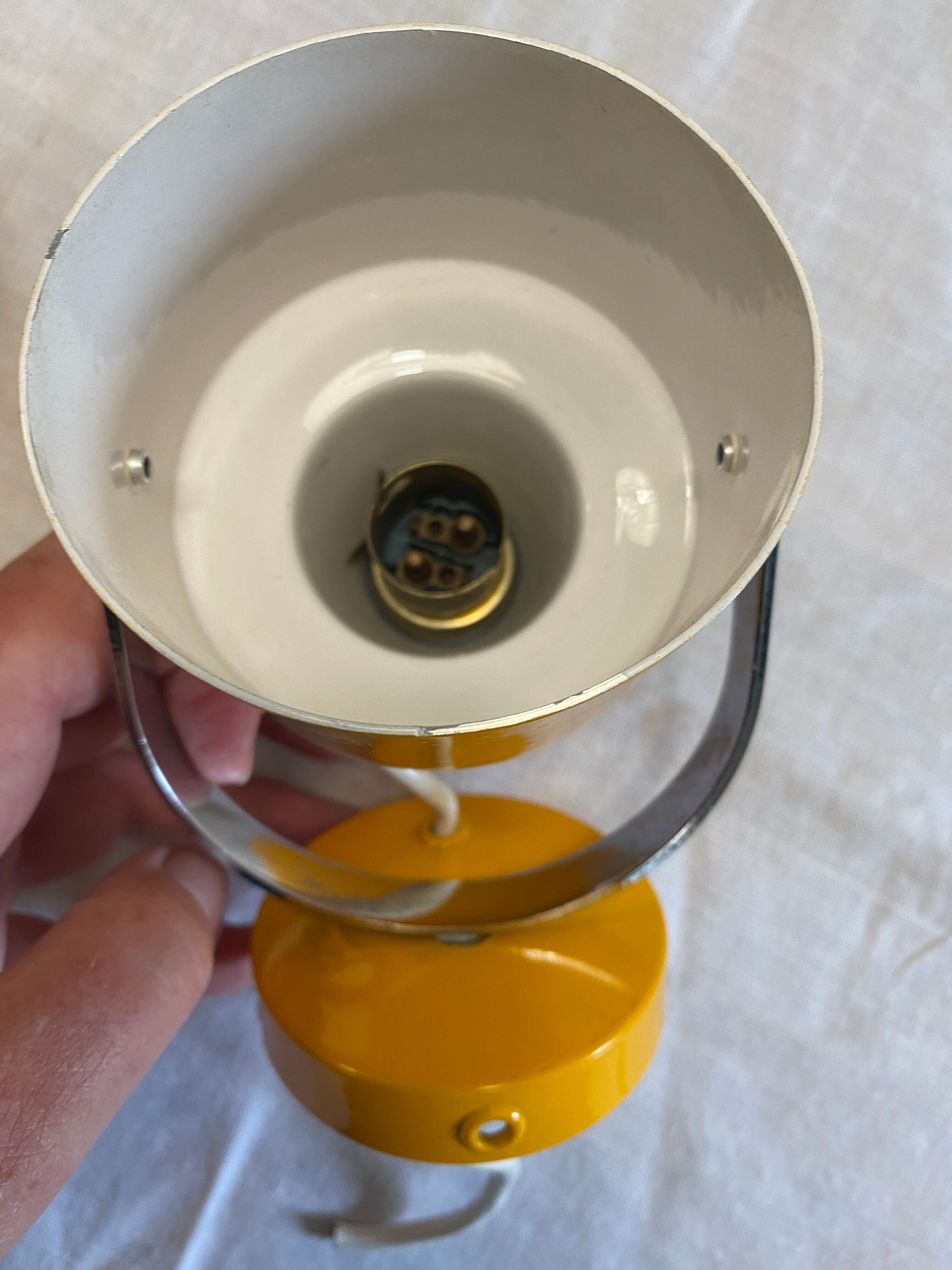 Pair of adjustable vintage wall lamps in yellow and chrome metal. Year 60