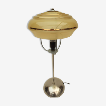 Table lamp on stainless steel stand, yellow and gold art deco frosted globe