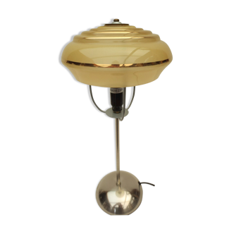 Table lamp on stainless steel stand, yellow and gold art deco frosted globe