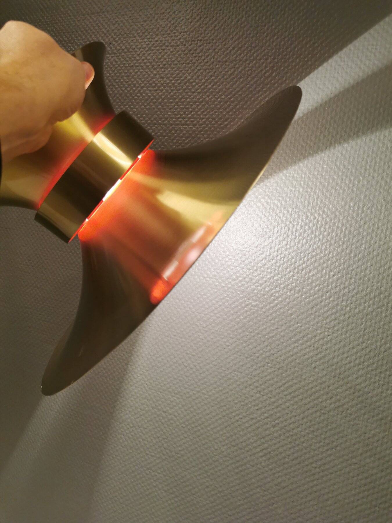 Large hanging lamp, made of brass-coloured aluminium with red and white contrast lacquer inside.