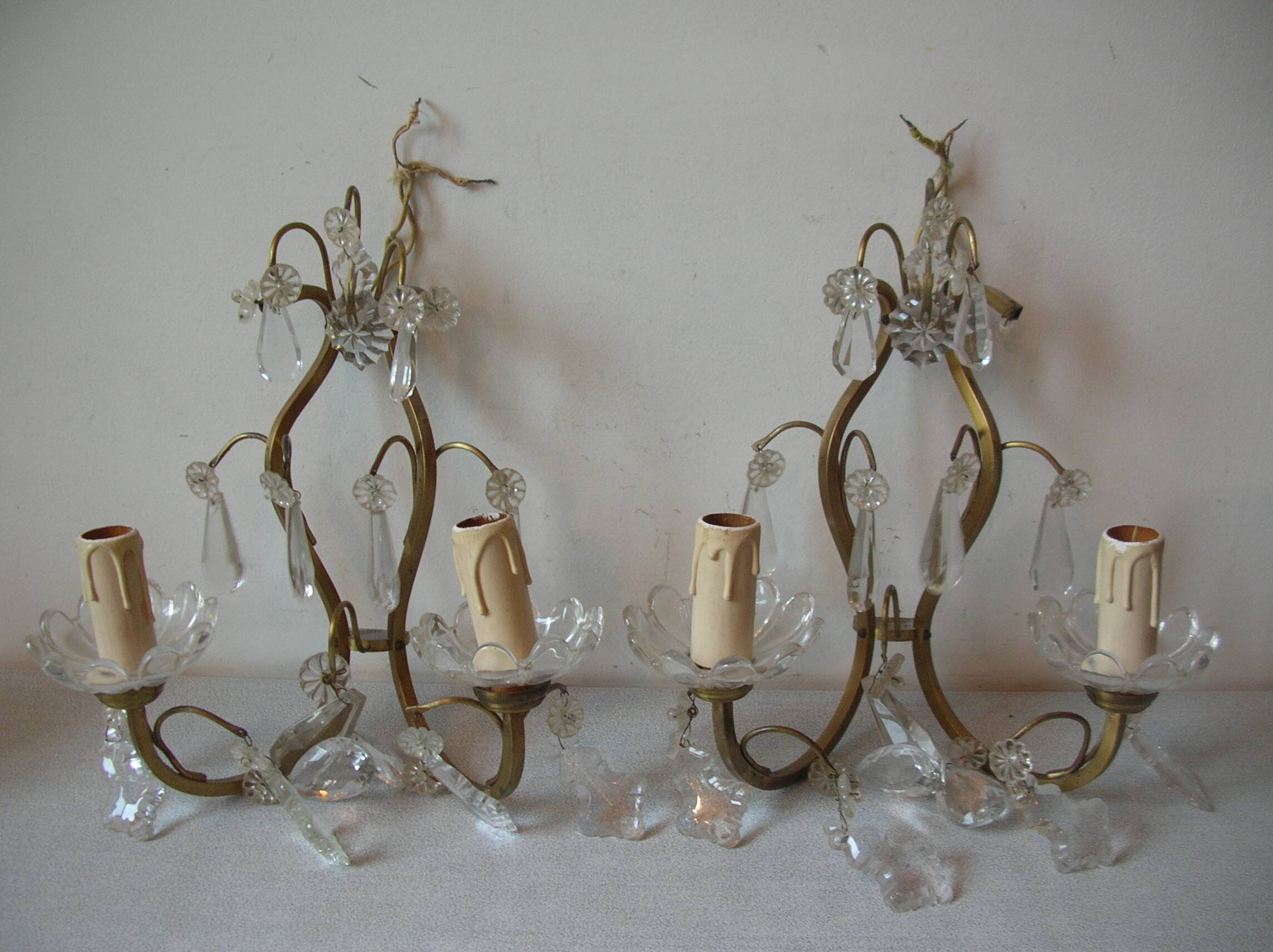 Old pair of double lamp lights with glass and brass pendants, retro decoration