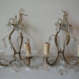 Old pair of double lamp lights with glass and brass pendants, retro decoration