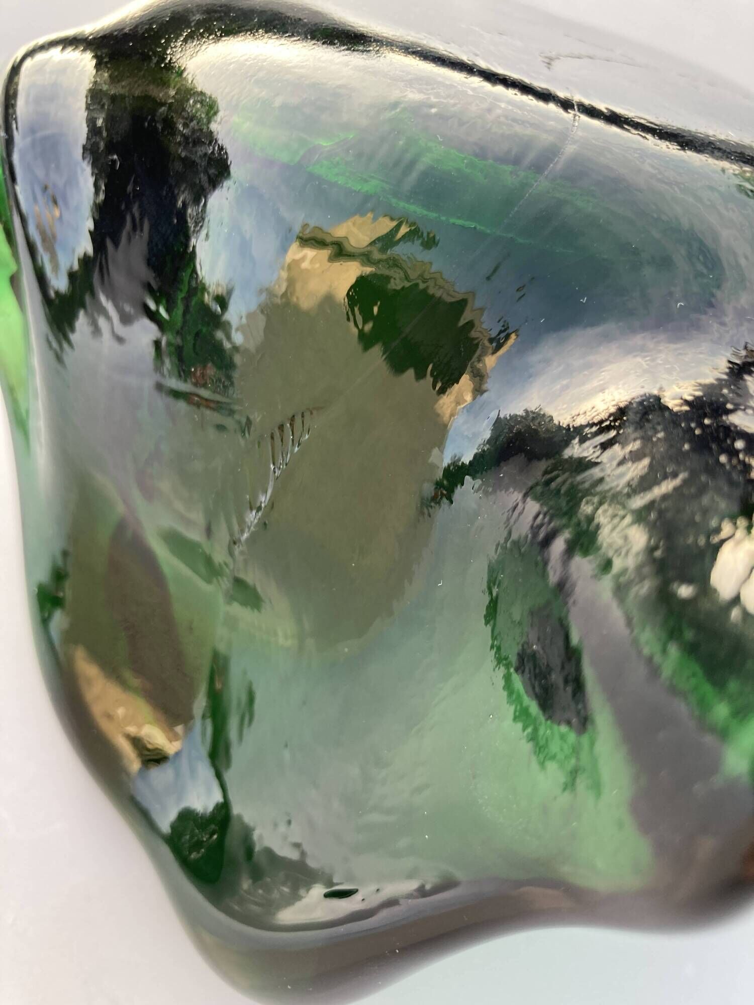 Sculptural ashtray in emerald green glass