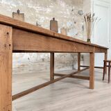 Solid wood workshop table with straight legs.