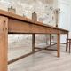 Solid wood workshop table with straight legs.