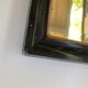 Miroir ancien bois noir et or