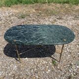 Oval coffee table in veined green marble