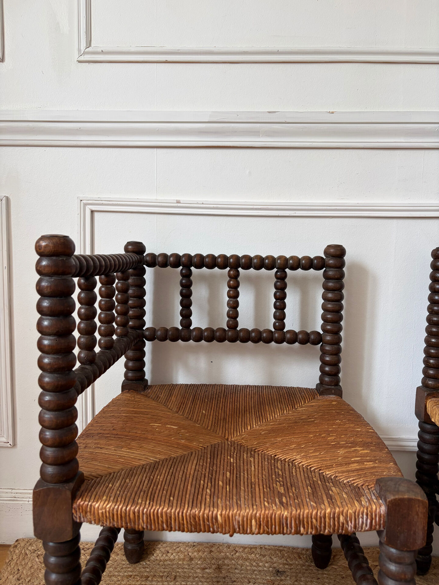 Pair of rush-seated chairs by the fireside "bobbin"
