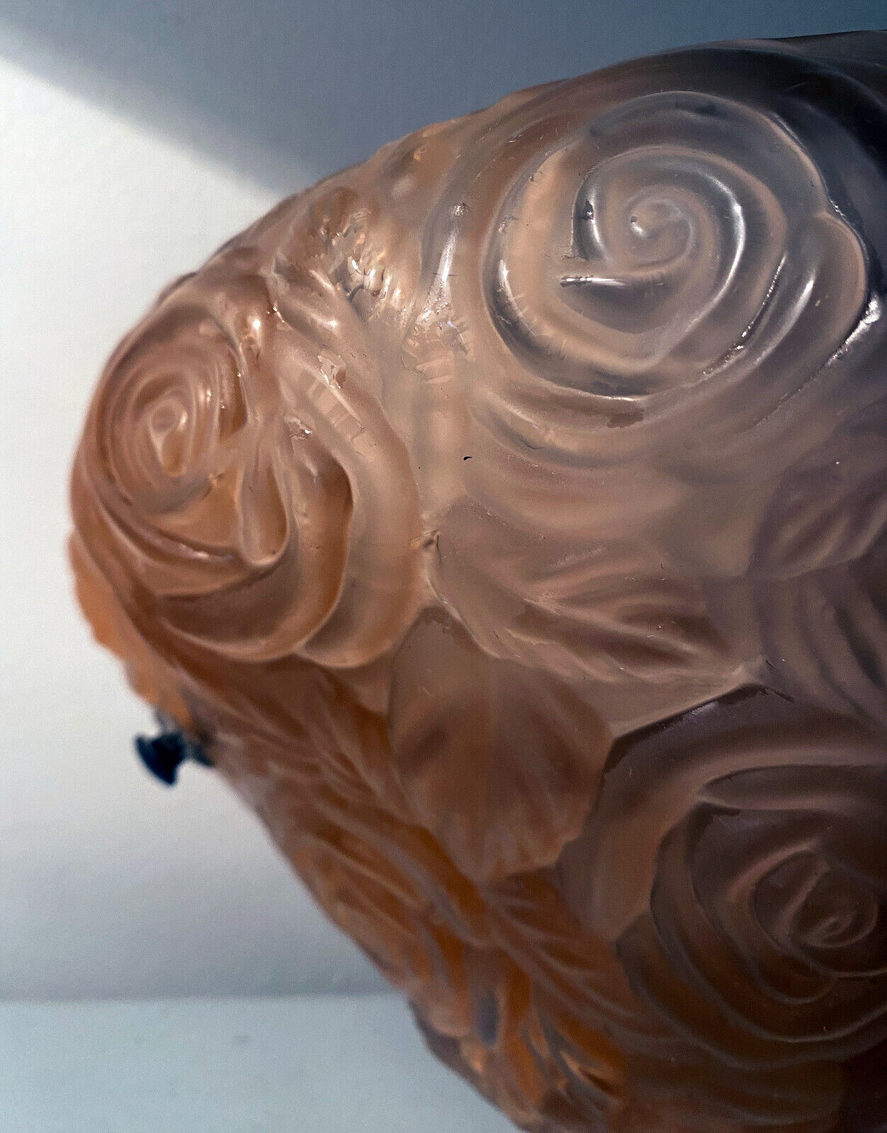 Art Deco wall lamp (1930) with rose patterns in molded pressed glass