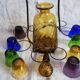 Old Italian alcohol decanter and its colorful glasses
