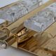 Pair of Hans-Agne Jakobsson wall lights in brass and pressed glass