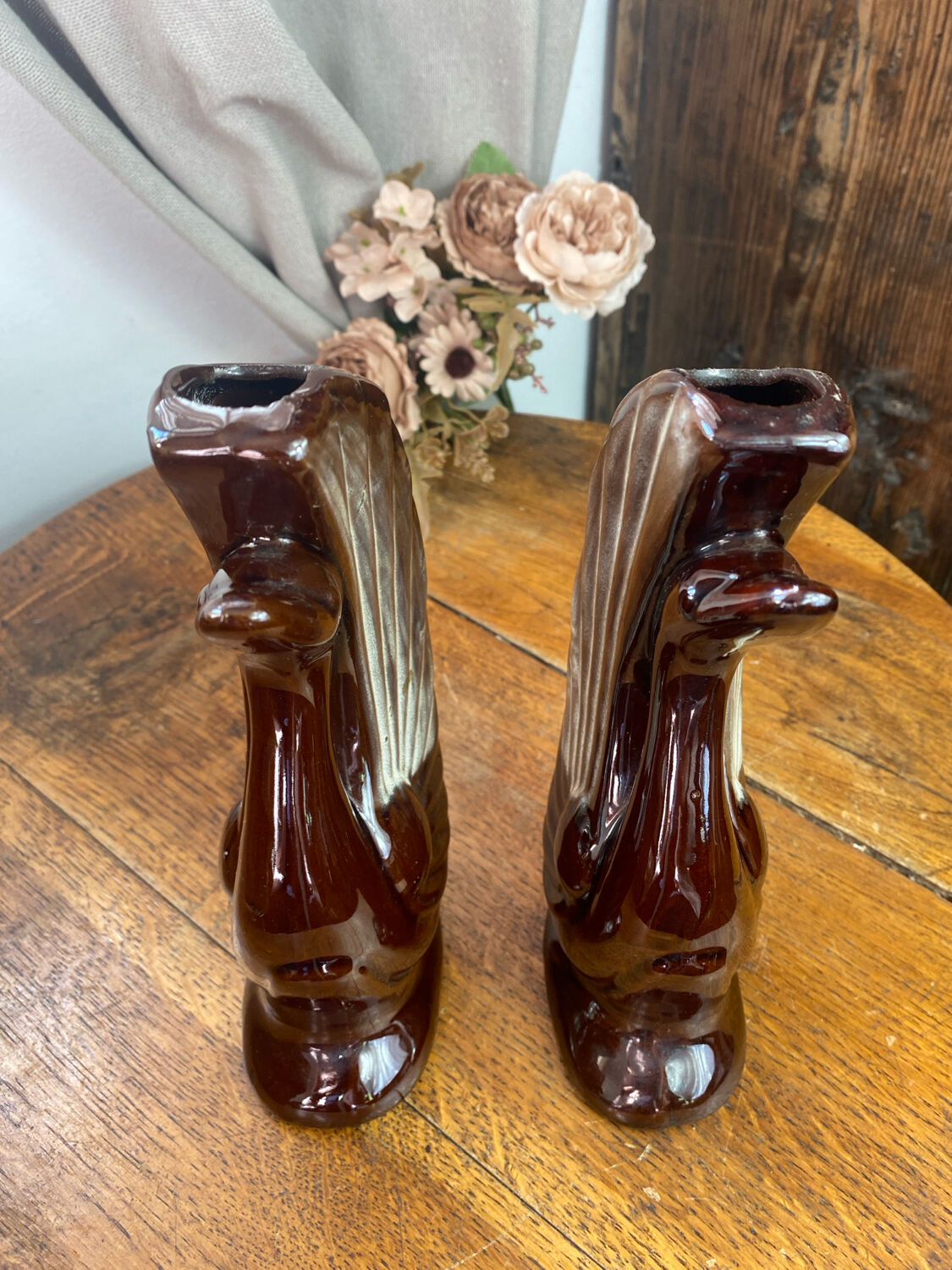 Pair of ceramic vases in the shape of swans.