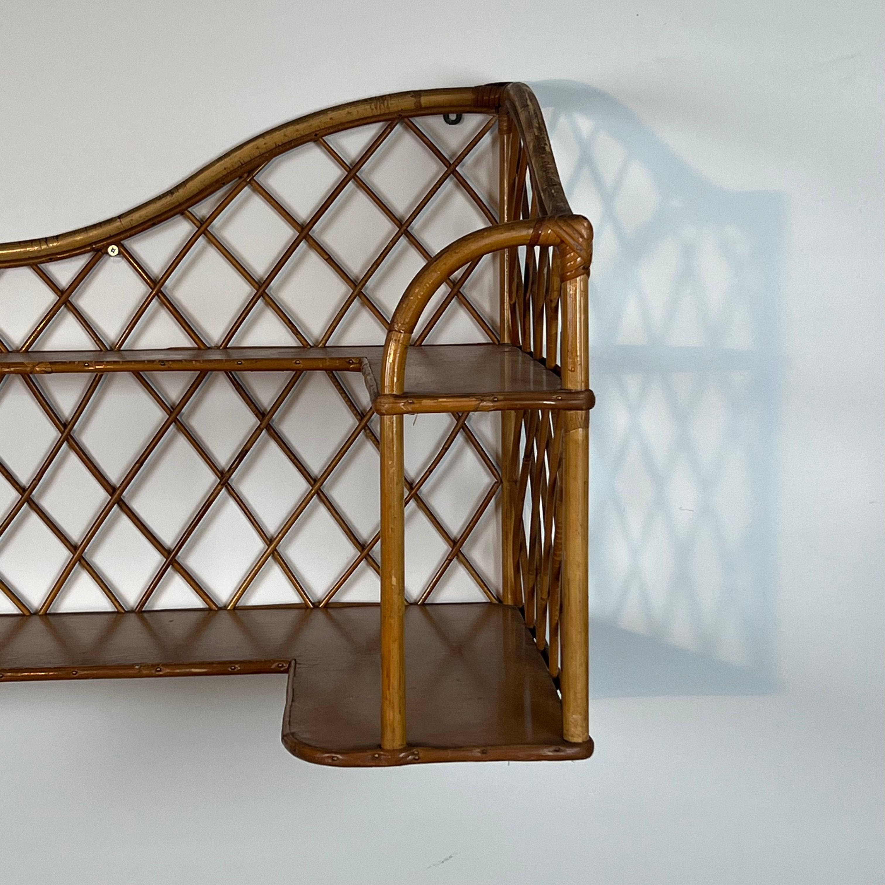 Corner wall shelf in rattan attributed to Audoux-Minet.