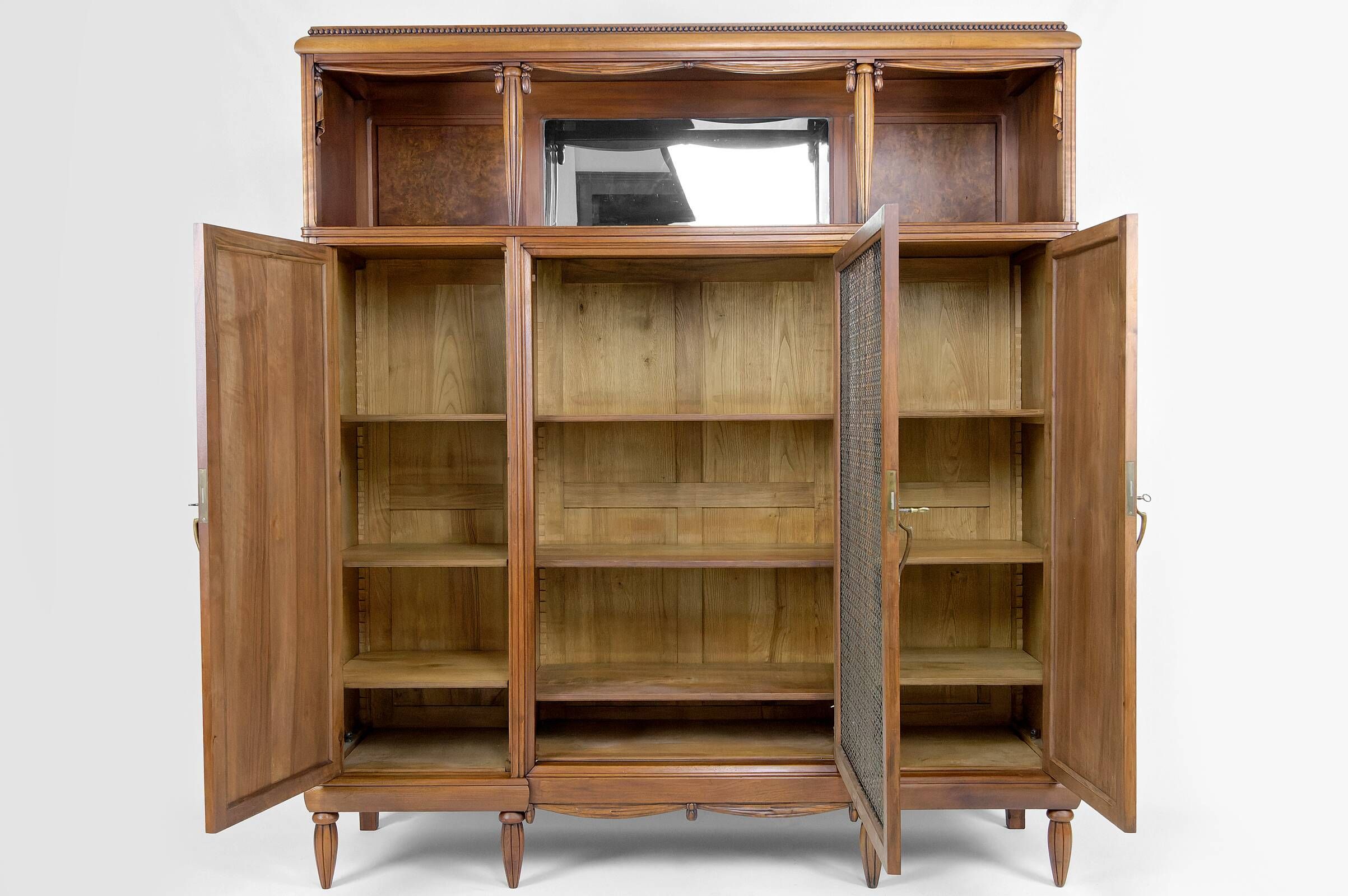 Art Deco showcase bookcase in carved walnut, France, circa 1925